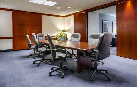 Conference room with table and chairs.